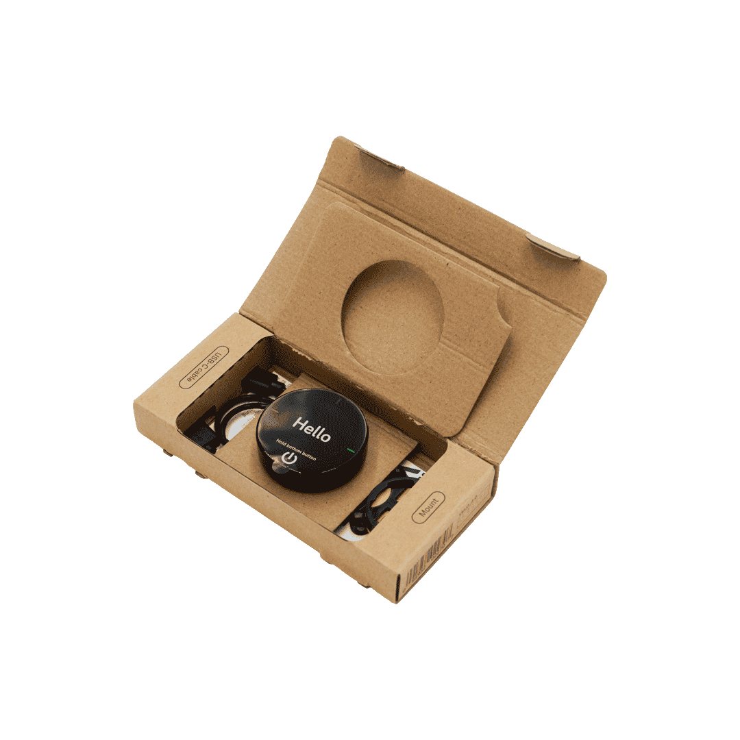 Beeline Velo 2 Fahrradcomputer in geöffneter Kartonverpackung mit Ladegerät und Halterung