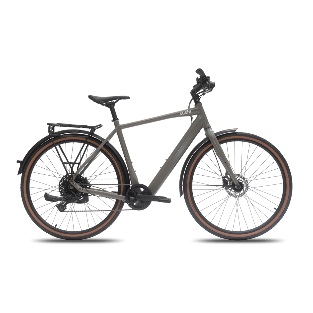 TABI Diamantrahmen in felsgrau in der Seitenansicht inklusive Gravelreifen, Gepäckträger und verstellbarem Lenker