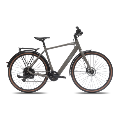 TABI Diamantrahmen in felsgrau in der Seitenansicht inklusive Gravelreifen, Gepäckträger und verstellbarem Lenker