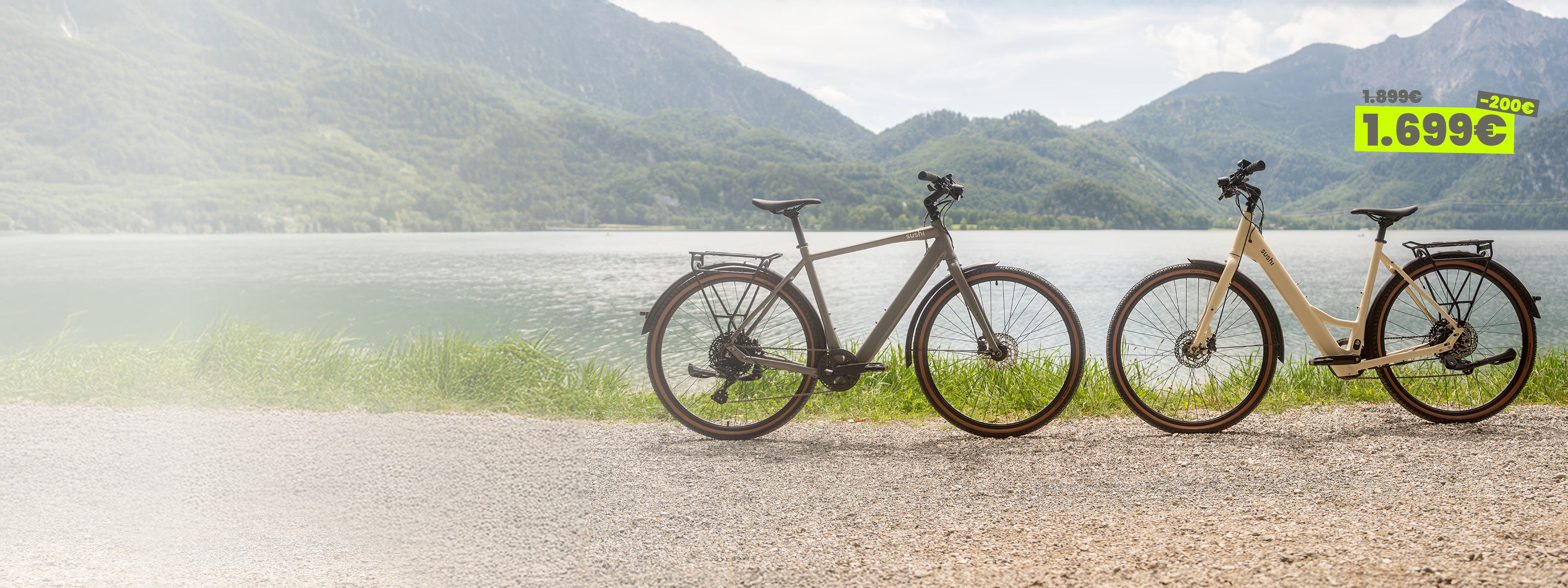 Trekking E-Bike TABI als Tiefeinsteiger und mit Diamantrahmen stehen vor einem Bergsee auf einem Schotterweg